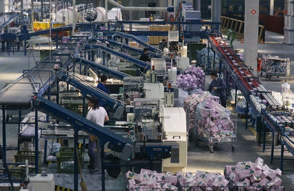 24 Mar 1989, Orleans, France --- Workers process tissues, napkins, and toilet paper at the Scott paper factory in OrlÈans. Scott manufactures paper towels, tissues, and toilet paper. --- Image by © Julio Donoso/Sygma/Corbis